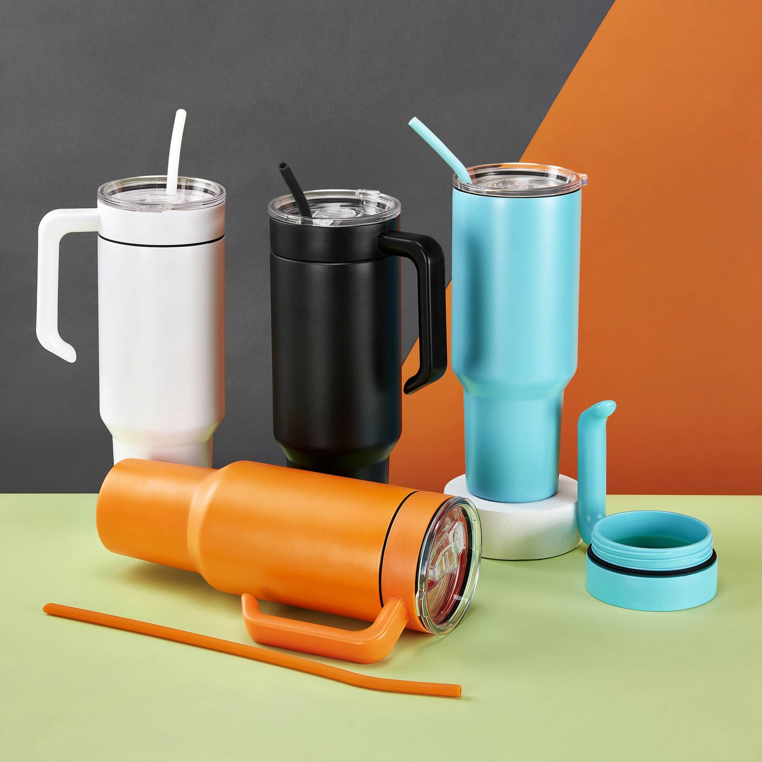 40oz MakerTwist Tumblers with matching handle  white, orange, black and teal